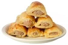 Permalink to Need a vacation? Take a taste tour of Europe! A plate stacked with festive sausage rolls.