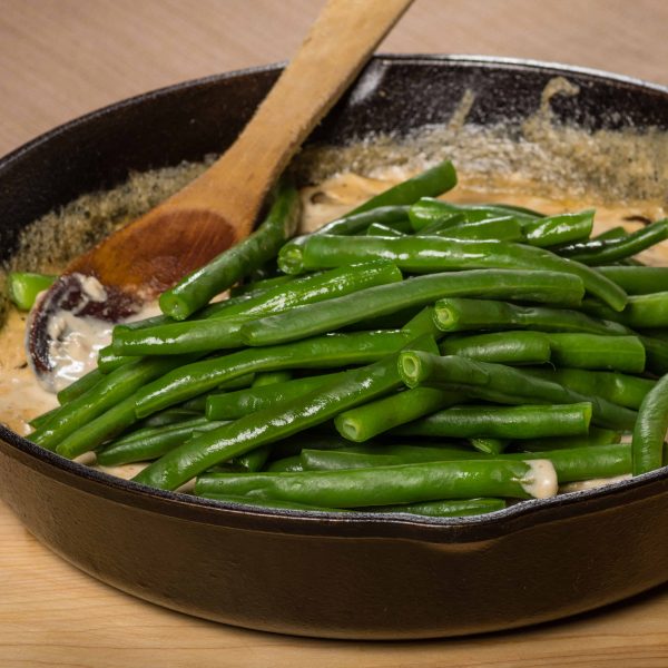 Preparing green beans to make a casserole