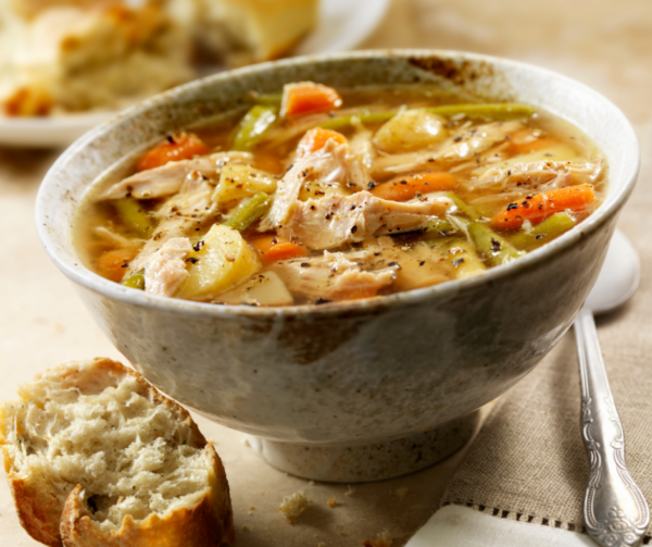 Untitled design Bowl of Turkey soup with vegetables